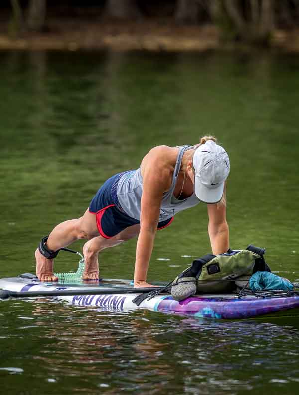 woman doing paddleboard yoga in Canton GA on lake