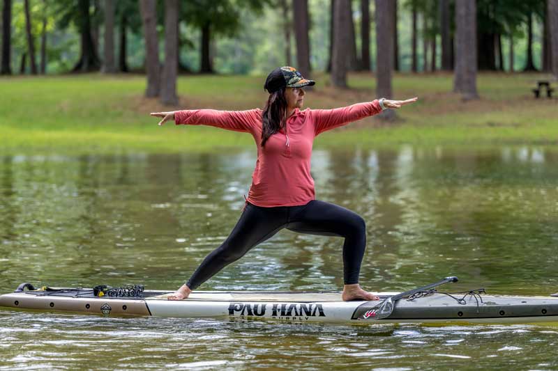 woman doing yoga on the water on Lake Lanier, GA